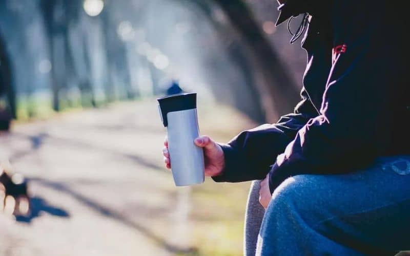 A person holding a water bottle