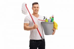 A man holding a mop and tools for cleaning