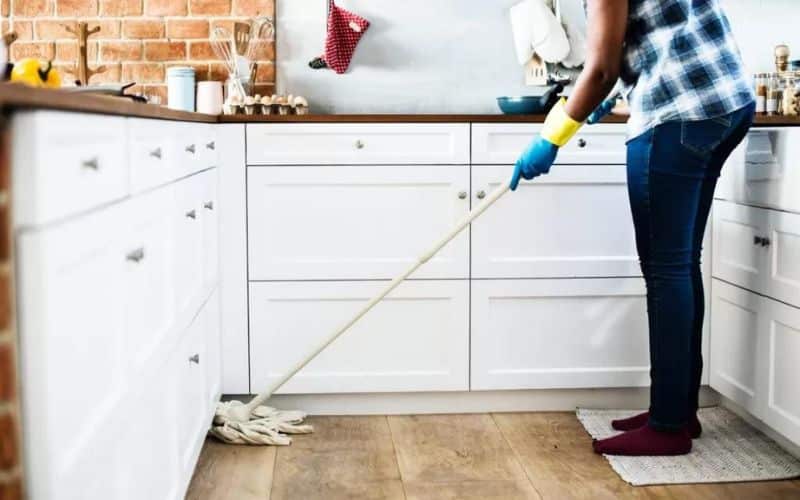 A person mopping the floor