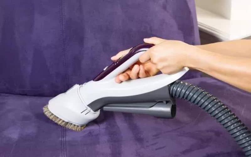 Cleaning the sofa with Vacuum Brush