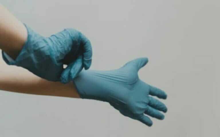 Putting on a glove for move out cleaning