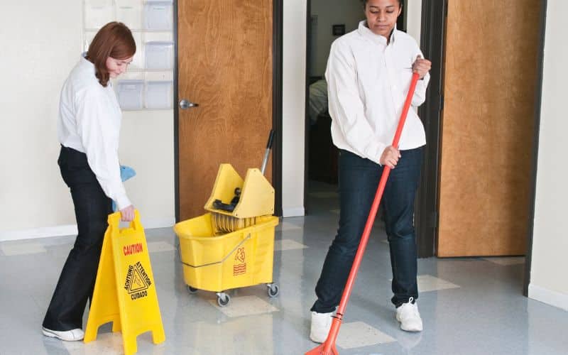 Janitor performing cleaning tasks with expertise